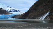 A waterfall pouring into Mendenhall Lake