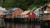 Buildings along creek street are held above the water by thick columns and support beams