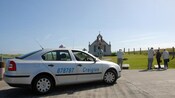 Side view of a 4 door taxi sedan outside the Italian Chapel in the Orkney Islands