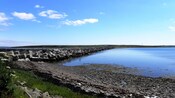 A rocky barrier leading from one end of Scapa Flow to the other end