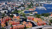 A neatly arranged harbor town with colorful Bryggen design buildings dominating the harbor