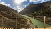 A bridge overlooking a gorge and a river