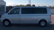 3 vans in a parking lot