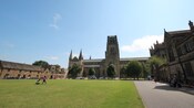 A large grassy lawn in front of medieval Durham Cathedral