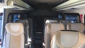 5 rows of comfortable bucket seats inside a minibus