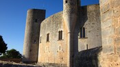 Exterior view of Bellver Castle featuring stone walls and windows