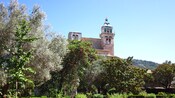 A medieval building with an ornate tower and spire