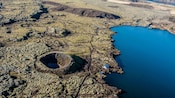 A meandering road cuts into the volcanic landscape of the Reykjanes Peninsula in Iceland