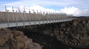 Walking bridge called The Bridge Between Continents spans a crevasse and a river