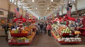 The barn like interior of the Old City Market reveals kiosks laden with fresh fruits and vegetables