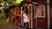 2 girls share cookies between small houses
