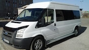 A Ford van with tinted windows