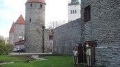 2 guards in medieval costume stand at the entrance at one of the famous Towers of Old Tallinn