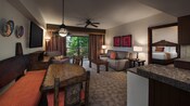 African-themed living area with couch, coffee table, chair, lamps, side tables, dining table, TV and art