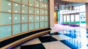 Lobby with checkered tiles and a wall of frosted windows