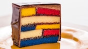 A classic Mondrian style painting is baked into a slice of cake and frosted in chocolate