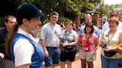Tour guide with tour group in the park