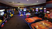 A Disney hotel arcade lined with video games, racing games and air hockey