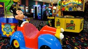Close-up of an assortment of plush toy prizes in a Disney hotel arcade