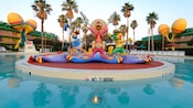 Statues of The Three Caballeros - Donald Duck, José Carioca and Panchito - stand in the center of the guitar-shaped Calypso Pool
