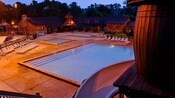 Swimming pool at Disney's Fort Wilderness Resort, lit up at night