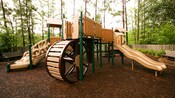A playground with slide and giant wheel at Disney's Port Orleans – Riverside