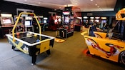 Air hockey, basketball and racing car games in an arcade at Disney's Saratoga Springs Resort & Spa