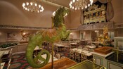 A green carousel 'seahorse' with a horse head and scaly fish tail presides over the dining room
