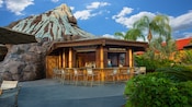Exterior view of Barefoot Pool Bar at Disney's Polynesian Resort, with Nanea Volcano in the background