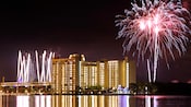 Fireworks in the night sky above Bay Lake Tower at Disney's Contemporary Resort