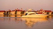 Speedboat cruising the lake past Disney's Grand Floridian Resort & Spa