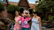 Mickey Mouse strolling with 2 Guests at Aulani, A Disney Resort & Spa