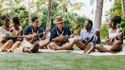 Guests playing ukelele in a circle
