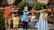 A family of 4 dancing with Minnie Mouse at Aulani, A Disney Resort & Spa in Ko Olina, Hawai&lsquo;i
