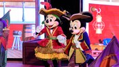 Minnie Mouse and Mickey Mouse dressed in pirate attire for Pirate Night on a Disney Cruise Line ship
