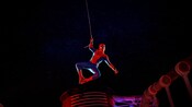 Spider Man performing his web swinging pose on the deck of a Disney Cruise Line ship during a Marvel Day at Sea event