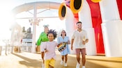 A family running on the upper deck of a Disney Cruise Line ship