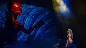 Moana encountering the goddess Te Ka during Disney The Tale of Moana, a stage show on board the Disney Treasure