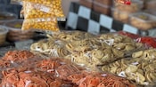 An assortment of chips and other packaged snacks at Padang Masirat market in Malaysia