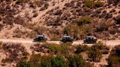 Guests riding Razor sport vehicles on a dirt road