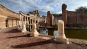 Ruins of the Maritime Theatre near a pool of water at Hadrian’s Villa in Tivoli, Italy