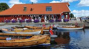 A café next to a marina filled with leisure boats