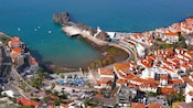An aerial view of Câmara de Lobos, a town located around a natural harbor in the Madeira archipelago