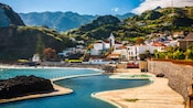The natural rock pools in Porto Moniz with the town in the background