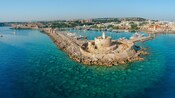 Saint Nicholas Fortress surrounded by waters in Rhodes, Greece