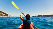 A Guest paddling a kayak