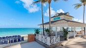 An open air bar at the edge of a beach