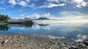 A cannery on a pier, stretching out into a fog covered inlet