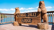 A wooden sign for the George Inlet Lodge in Alaska