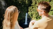 Two Guests looking down at Omanawa Falls